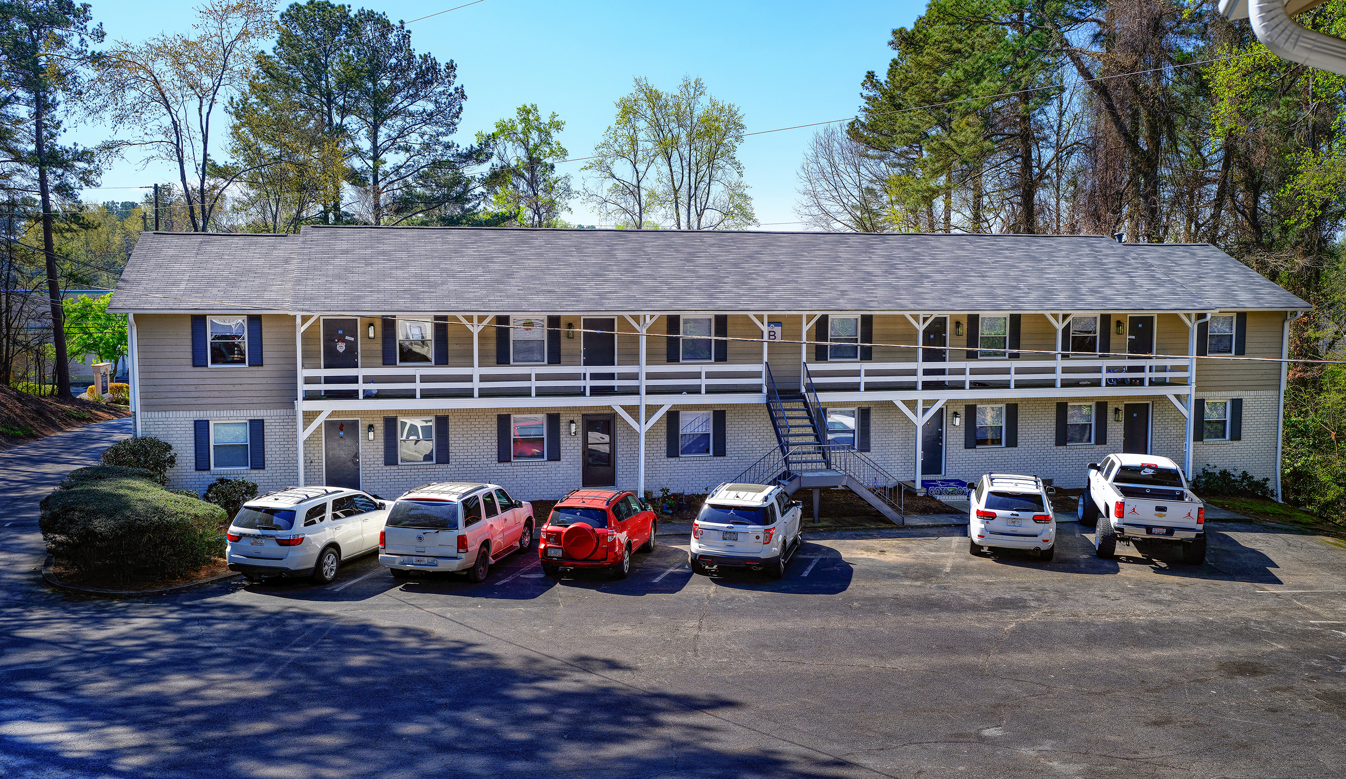 front portion of Midwood Chestnut showing cars in the parking ot